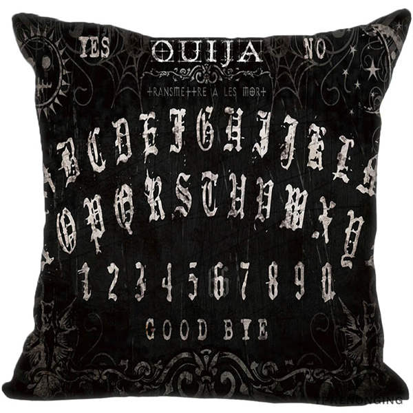 Black square Ouija pillow cover with decorative pale Gothic-style alphabet rows, fine curls and stars, and Yes, No and Good Bye lettering.