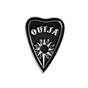 Black triangular Ouija planchette enamel pin with a silver-tone sun, central opening and small Ouija lettering.