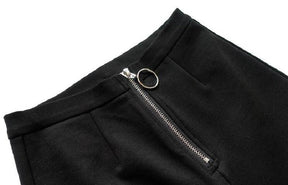 Close-up of the black pants waistband and silver-tone front zipper with a large circular pull.