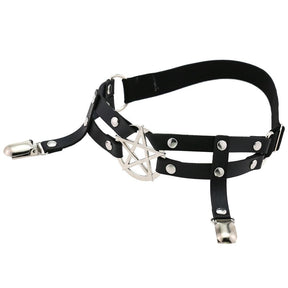 Angled top view of the black pentagram garter, showing the circular band shape, silver-tone front ring and suspended stocking clips.