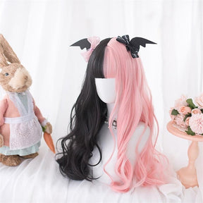 Long black and pastel pink split-color wig with full bangs and wavy lengths, displayed on a mannequin.