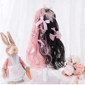 Long black and pastel pink split-color wig with full bangs and wavy lengths, displayed on a mannequin.