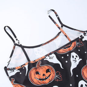 Flat view of the dress’s back neckline and two narrow black straps, with orange pumpkin and white ghost artwork below.