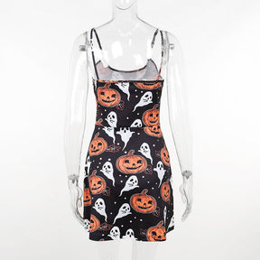 Back view of the spaghetti-strap pumpkin-and-ghost dress on a clear mannequin, with the all-over print continuing across the back and skirt.