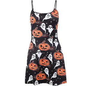 Black sleeveless skater mini dress isolated against white, with thin straps and an all-over print of orange jack-o-lanterns, white ghosts and stars.