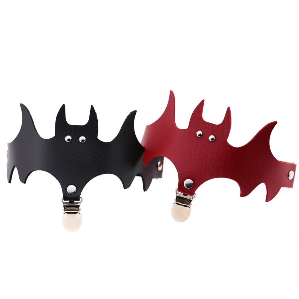 Black and red bat leg garters displayed together, comparing the same winged shape in two colours.
