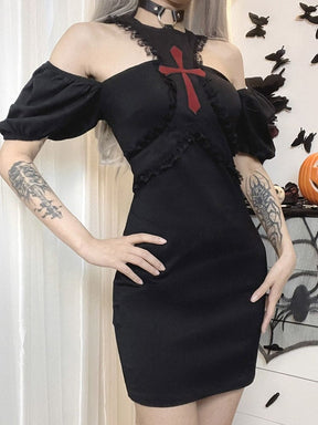 Angled pose in the black red-cross dress with both puff sleeves lowered below the shoulders and one hand resting at the hip.