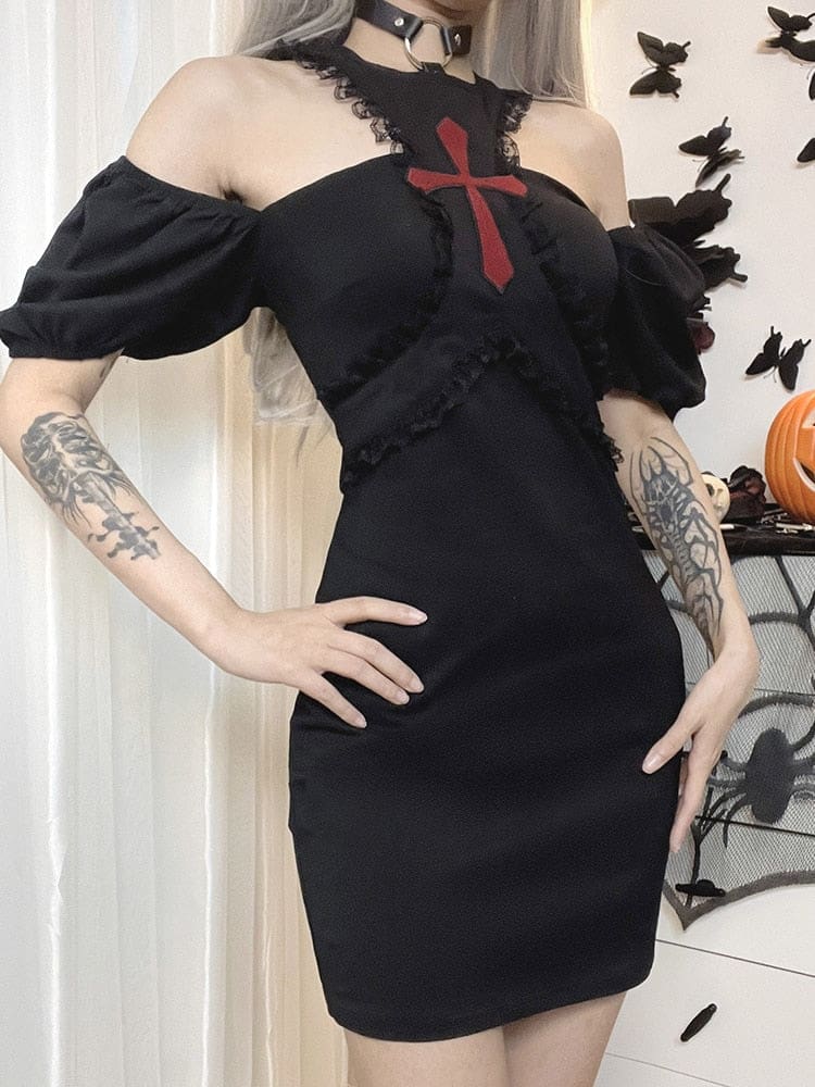 Angled pose in the black red-cross dress with both puff sleeves lowered below the shoulders and one hand resting at the hip.