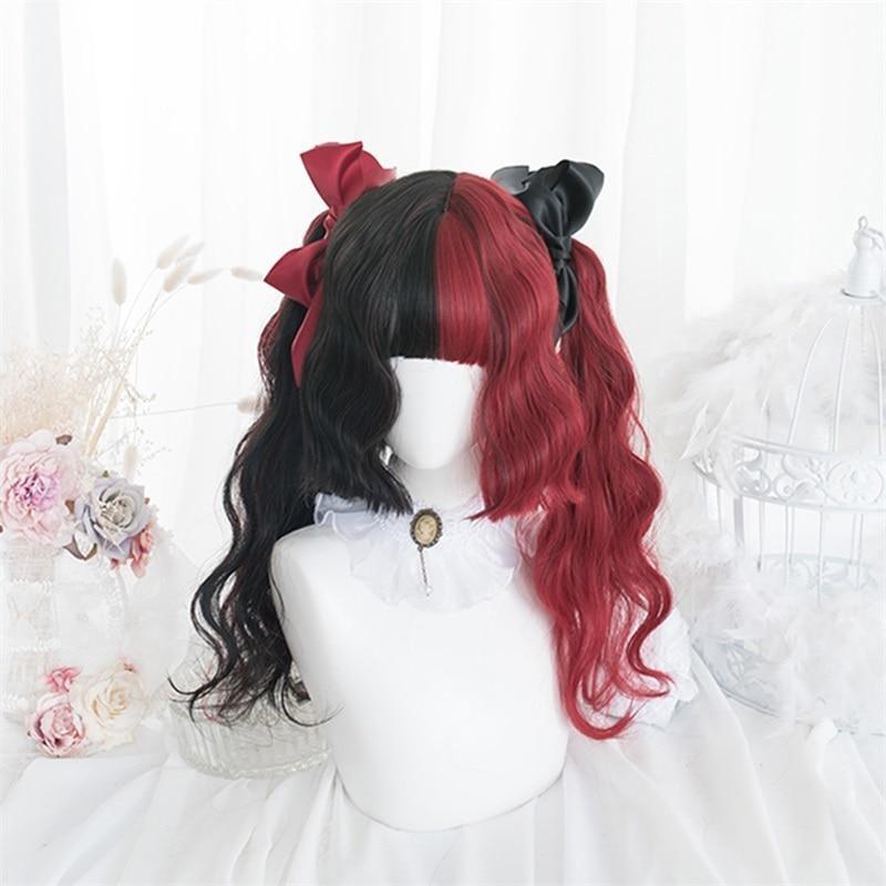 Black-and-red split-color wig with full bangs and loose curls, displayed on a white mannequin with contrasting red and black bows above the sides.