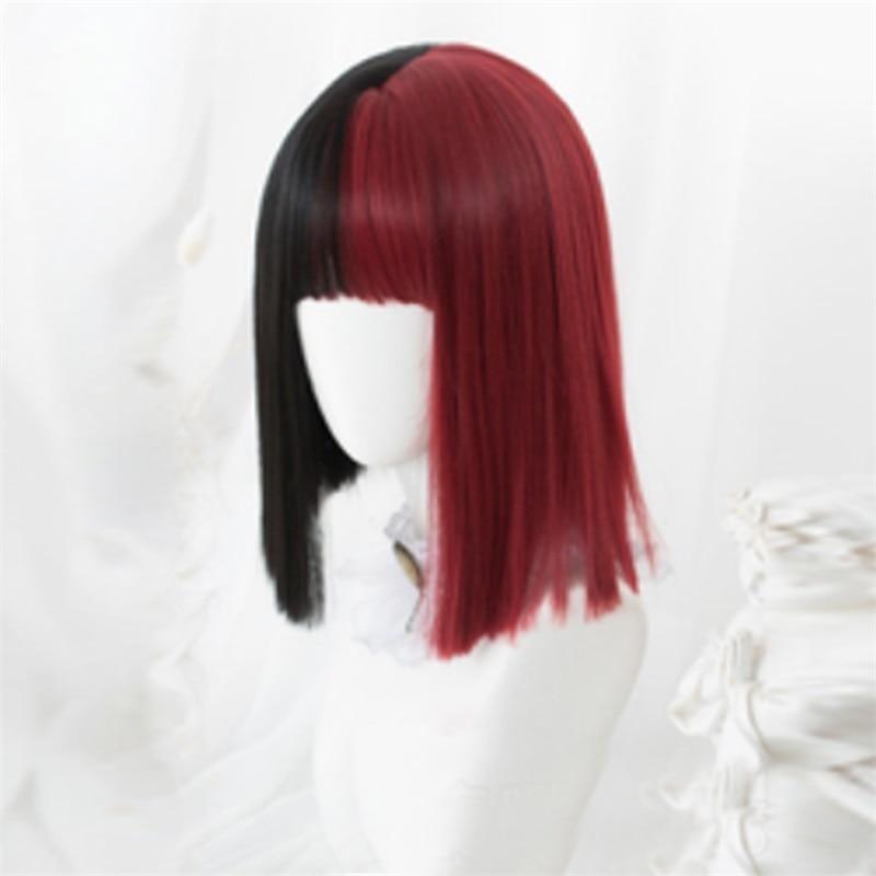 Short straight black-and-red split-color bob wig on a white mannequin, showing blunt bangs and ends reaching around the shoulders.