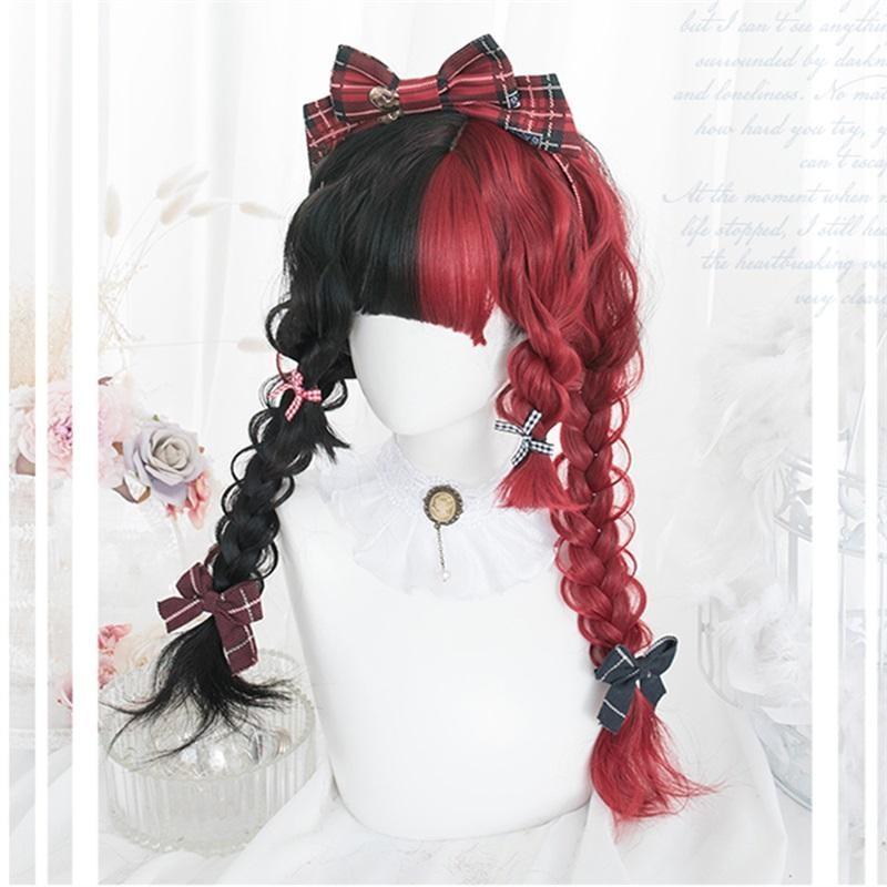 Black-and-red wig styled in two thick braids beneath split-color bangs, with a large plaid bow on top and smaller bows along the braids, displayed on a white mannequin.