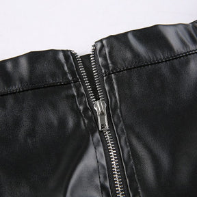 Close-up of the black skirt’s opened back zipper, showing the zipper teeth and inner edge of the waistband.