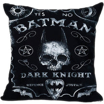 Black square cushion cover with white distressed lettering, a horn-like pointed skull silhouette, bats, pentagrams and a printed planchette.