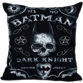 Black square cushion cover with white distressed lettering, a horn-like pointed skull silhouette, bats, pentagrams and a printed planchette.