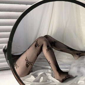 Black fishnet tights with repeating skull-and-crossbones motifs on a fine mesh background
