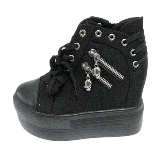 Black high-top platform sneaker displayed at an angle, with two skull zipper pulls and silver-tone eyelets around the ankle.