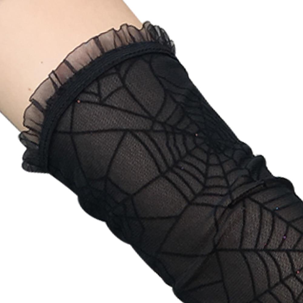Black spiderweb gloves with a close view of the ruffled upper edge.