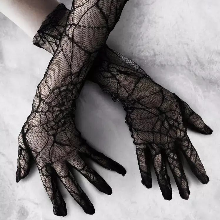 Black spiderweb gloves in an existing full-finger styling photo; both available options are fingerless.