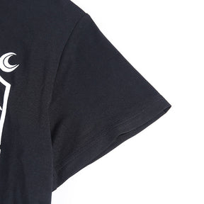 Black The Witch tarot-style graphic T-shirt with a close view of the sleeve seam.