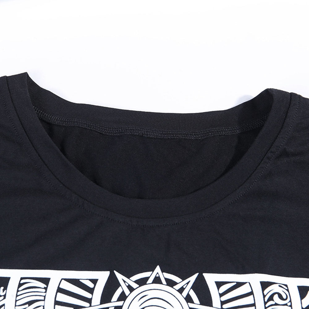 Black The Witch tarot-style graphic T-shirt with a close view of the round neckline.