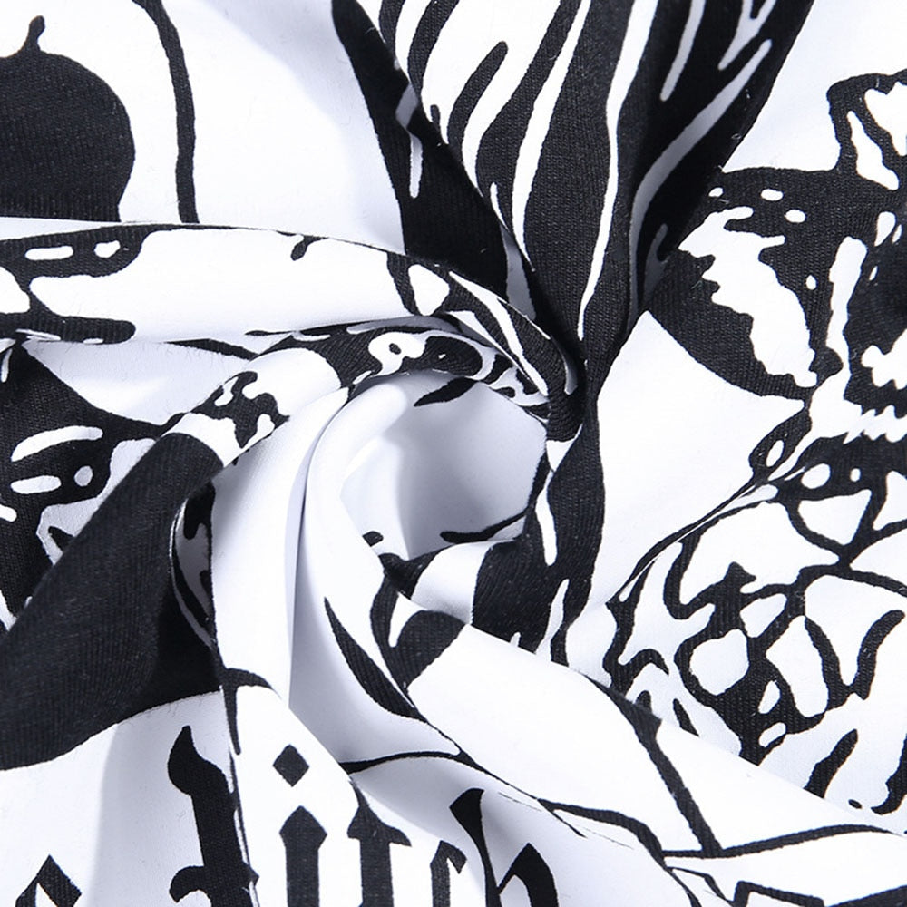 Black The Witch tarot-style graphic T-shirt showing the printed fabric gathered into folds.