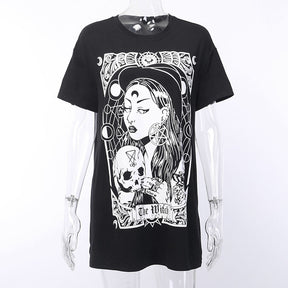 Black The Witch tarot-style graphic T-shirt displayed from the front on a clear mannequin.