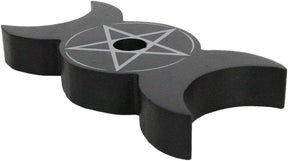 Three-quarter view of the black triple moon holder against white, with crescent cutouts on either side of the pentagram.