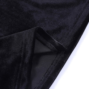 Close-up of the black velvet sleeve edge turned back to show the seam and reverse side of the fabric.
