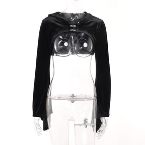 Black velvet hooded bolero shown alone on a clear mannequin, revealing its cropped shape, open front and two clasps without a camisole underneath.
