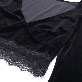 Flat close-up of the black velvet crop top’s V-neck and wide scalloped floral lace hem against white.