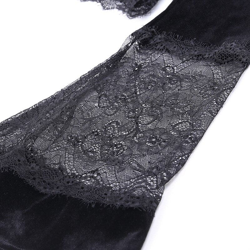 Close-up of a sheer floral lace insert joining sections of black velvet along a bell sleeve, showing the fine mesh and scalloped pattern.