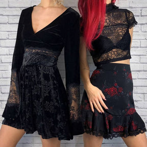 Two models stand beside a pale brick wall; the model on the left wears the V-neck velvet bell-sleeve crop top with a dark patterned skirt.