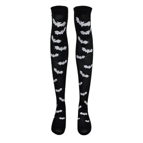Black over-the-knee stockings with white bats displayed as a pair on white.