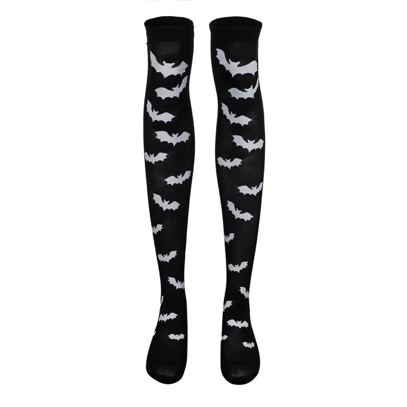 Black over-the-knee stockings with white bats displayed as a pair on white.