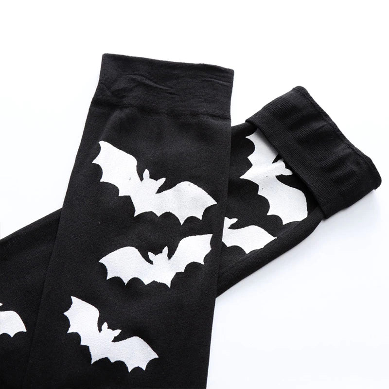 Black over-the-knee stockings with white bats with the upper cuffs and bat pattern laid flat.