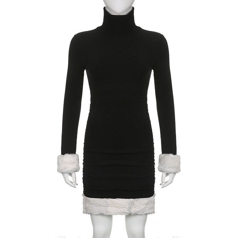 Black holiday mini dress with white fluffy cuffs and hem displayed from the front on a mannequin.