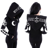 Front and back outfit views of a black zip-up witchcraft hoodie with white sleeve symbols and a large printed hood.