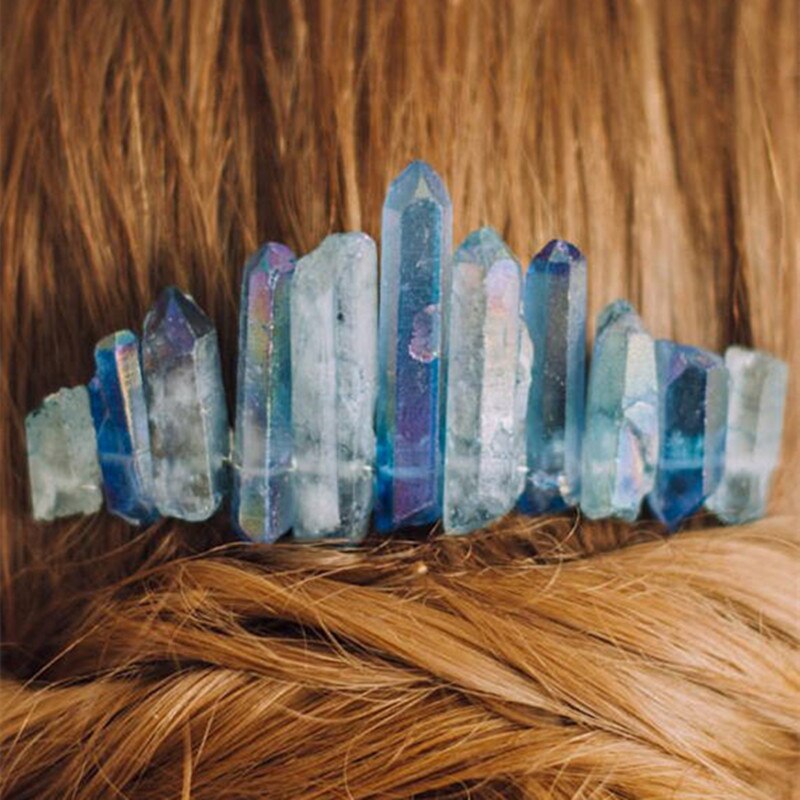 Close view of the blue crystal point comb worn in hair, with pale blue and violet flashes across the stones.