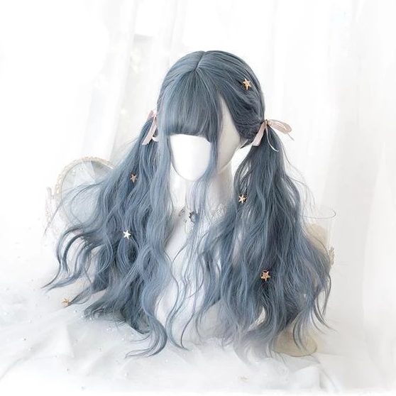 Smoky blue-gray gothic wig styled in long side bunches on a white mannequin, with full bangs, pale pink ribbon bows and gold-tone star clips. Loose waves curve through the lengths.