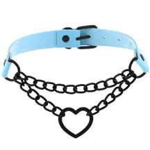 Blue pastel goth choker with black chain links, an open heart and a matching black buckle, photographed against white.
