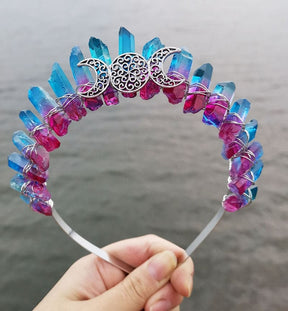 Blue and pink crystal points form the front of a wire-wrapped crown, with a silver-tone triple moon design across the centre.