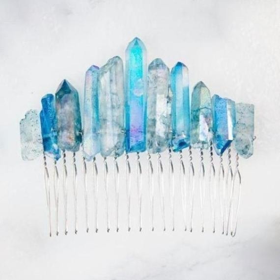 Blue quartz hair comb against white, showing its straight silver-tone teeth beneath irregular pointed stones.