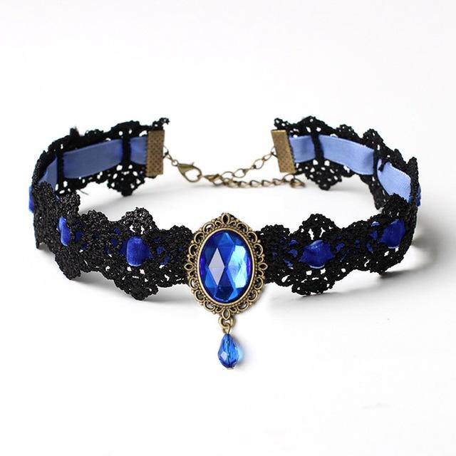 Black lace choker with an ornate oval centerpiece and hanging teardrop in the Blue ribbon and jewel option.