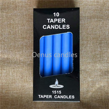 Blue ritual candles with their packaging, arranged to show the slim shape and blue colour.