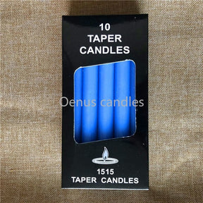 Blue ritual candles with their packaging, arranged to show the slim shape and blue colour.