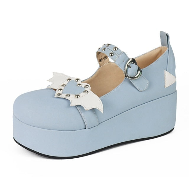 Blue Winged Heart Mary Jane with a matching platform sole and pale decorative heart framed by white bat wings.