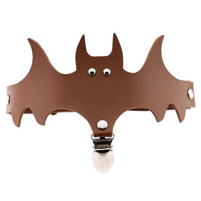 Brown bat-shaped leg garter with outstretched wings, small eye details and a hanging stocking clip.