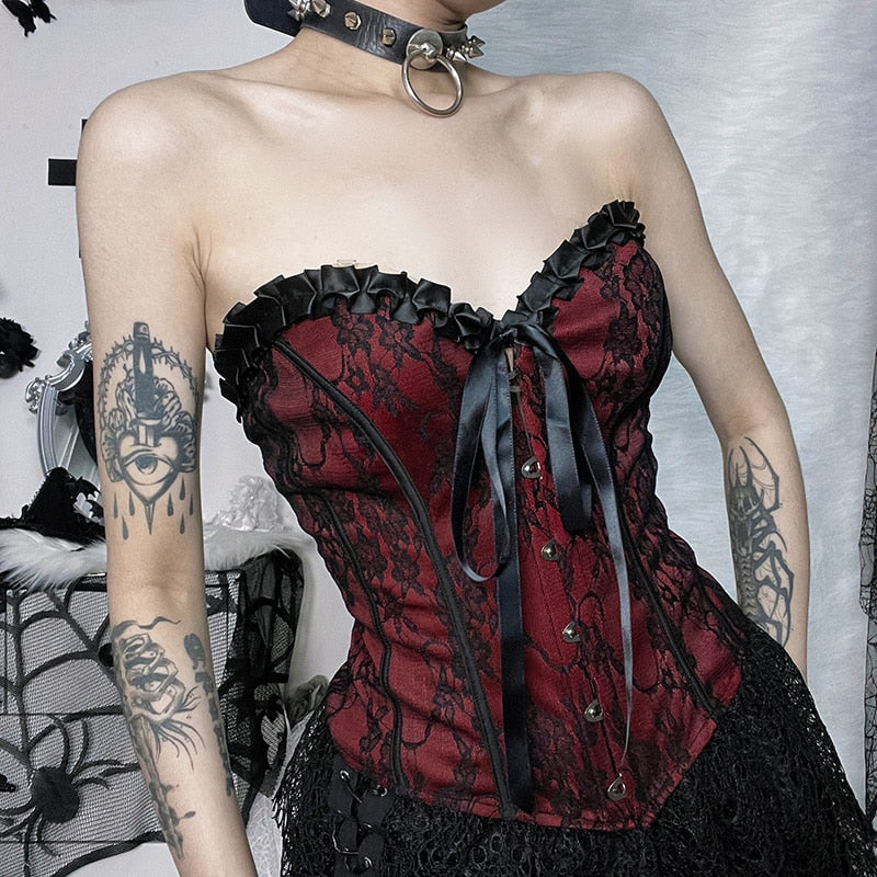 Burgundy strapless corset top with black floral lace shown in an angled outfit view.