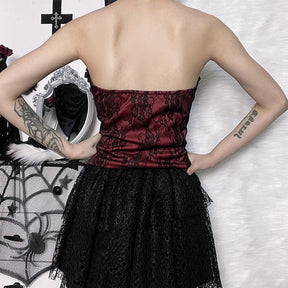 Burgundy strapless corset top with black floral lace shown in a rear outfit view.