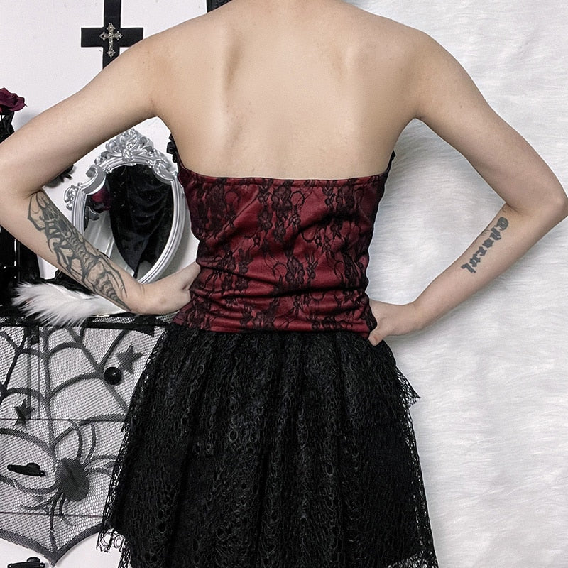Burgundy strapless corset top with black floral lace shown in a rear outfit view.
